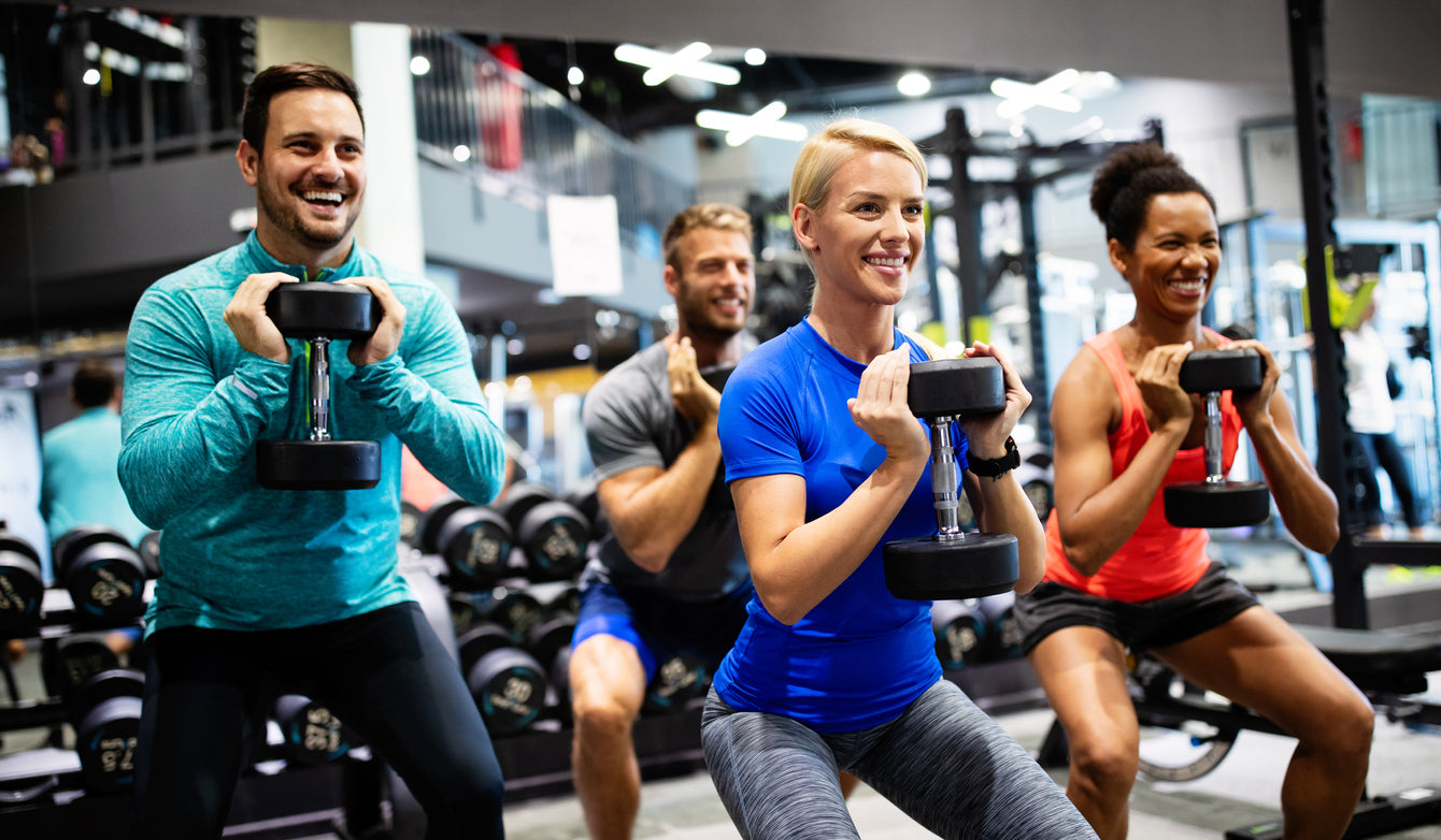 group of people wearing gym clothes exercising