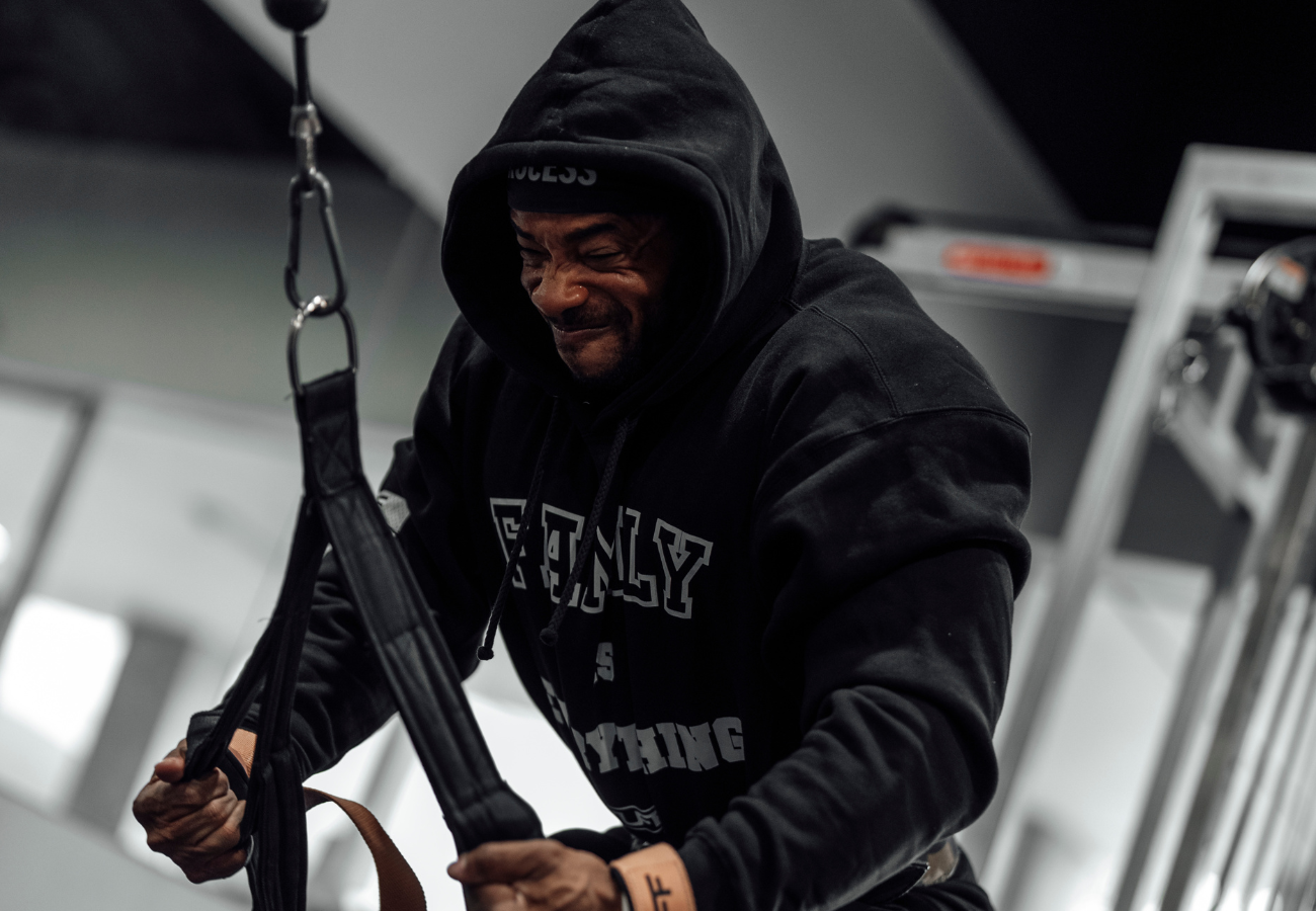 man in hoodie cold garage gym