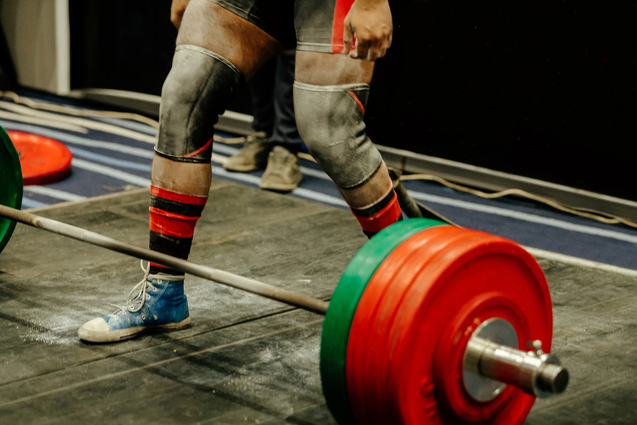 man with tight knee sleeves